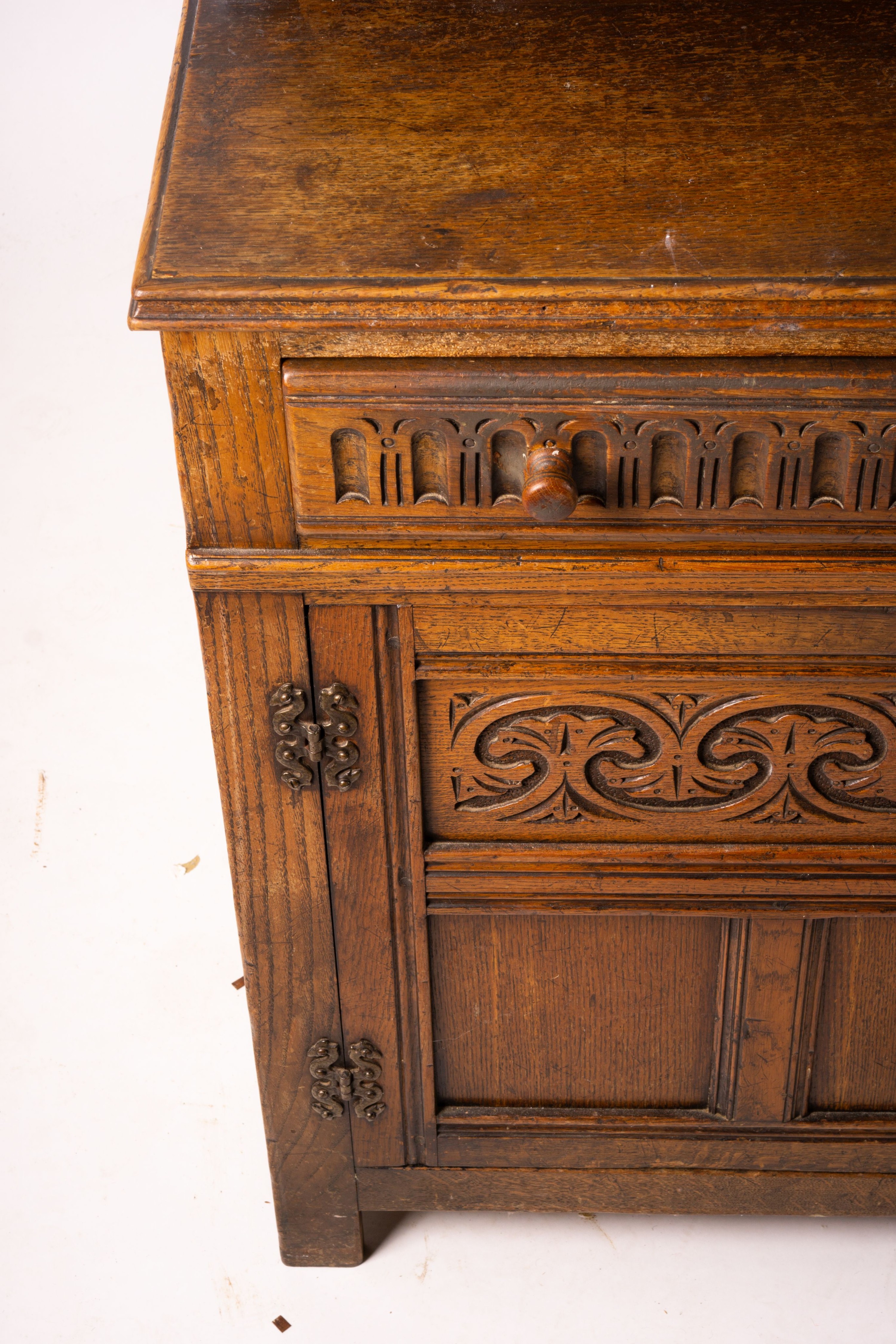 An 18th century style carved oak dresser, width 124cm, depth 46cm, height 175cm